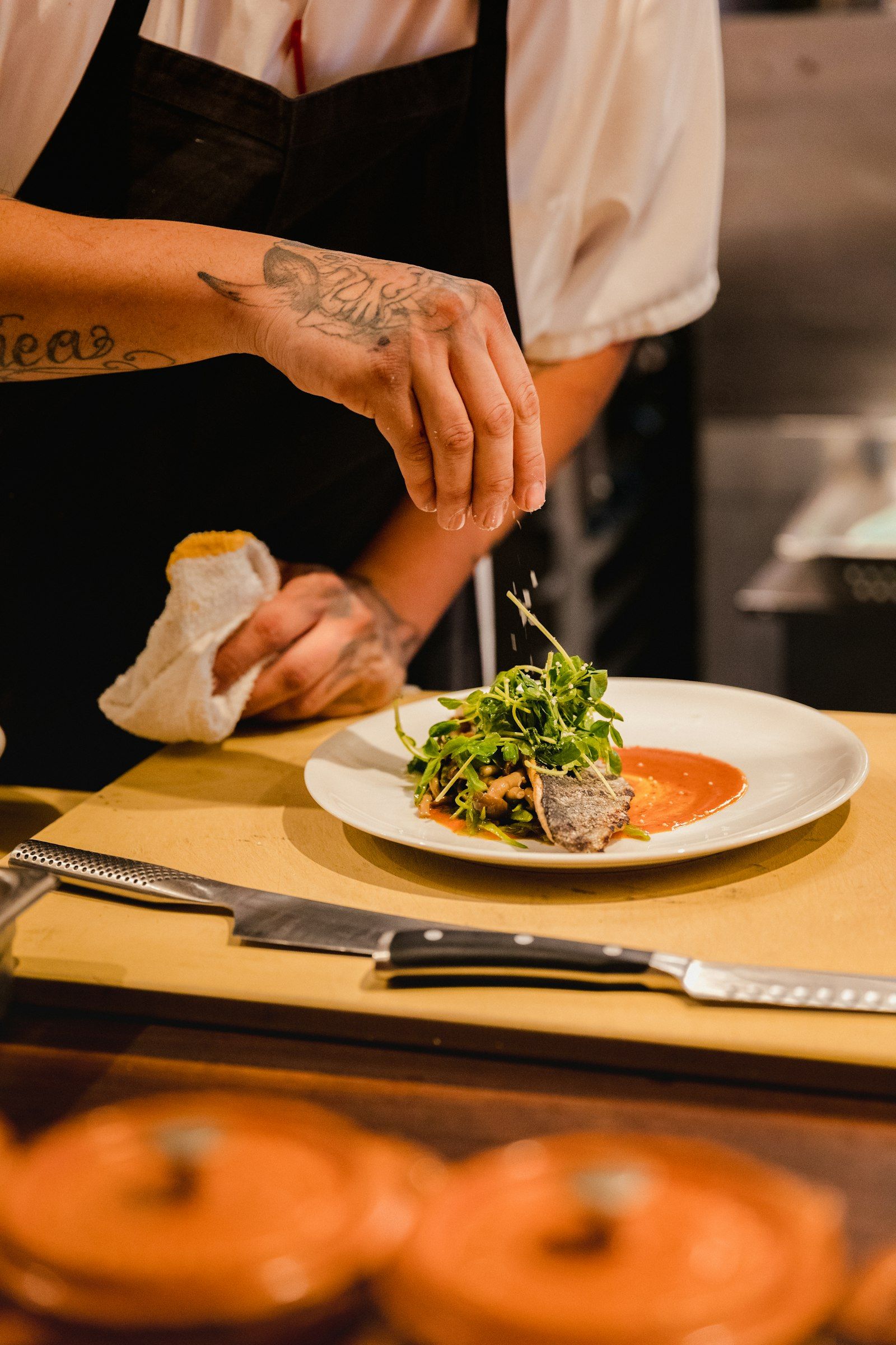 A thick slice of toasted sourdough piled with deep red roasted tomatoes and a torn ball of creamy burrata, finished with basil.